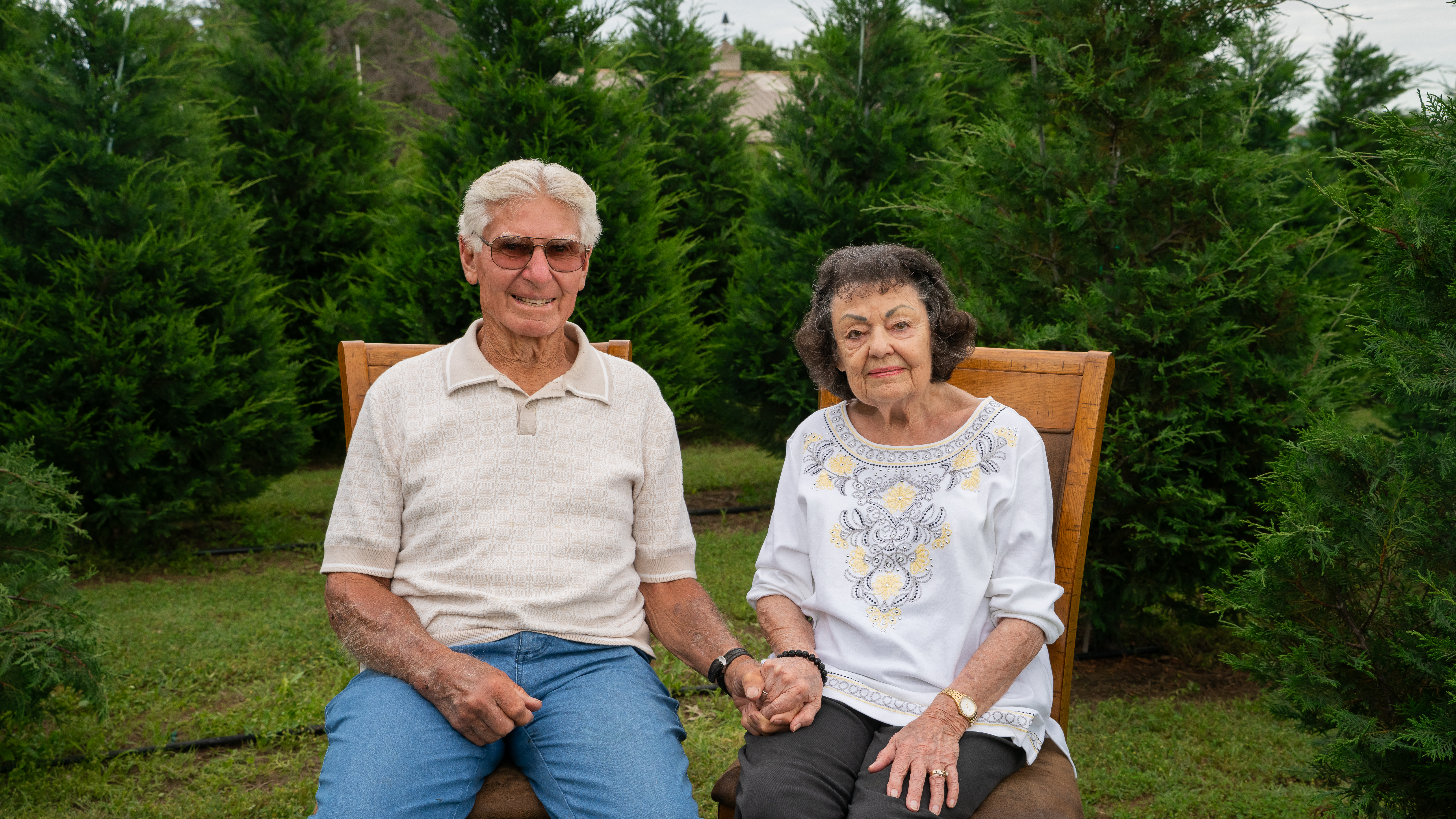 The Jacobs family standing together at their Christmas tree farm, representing generations of faith, hard work, and family tradition.